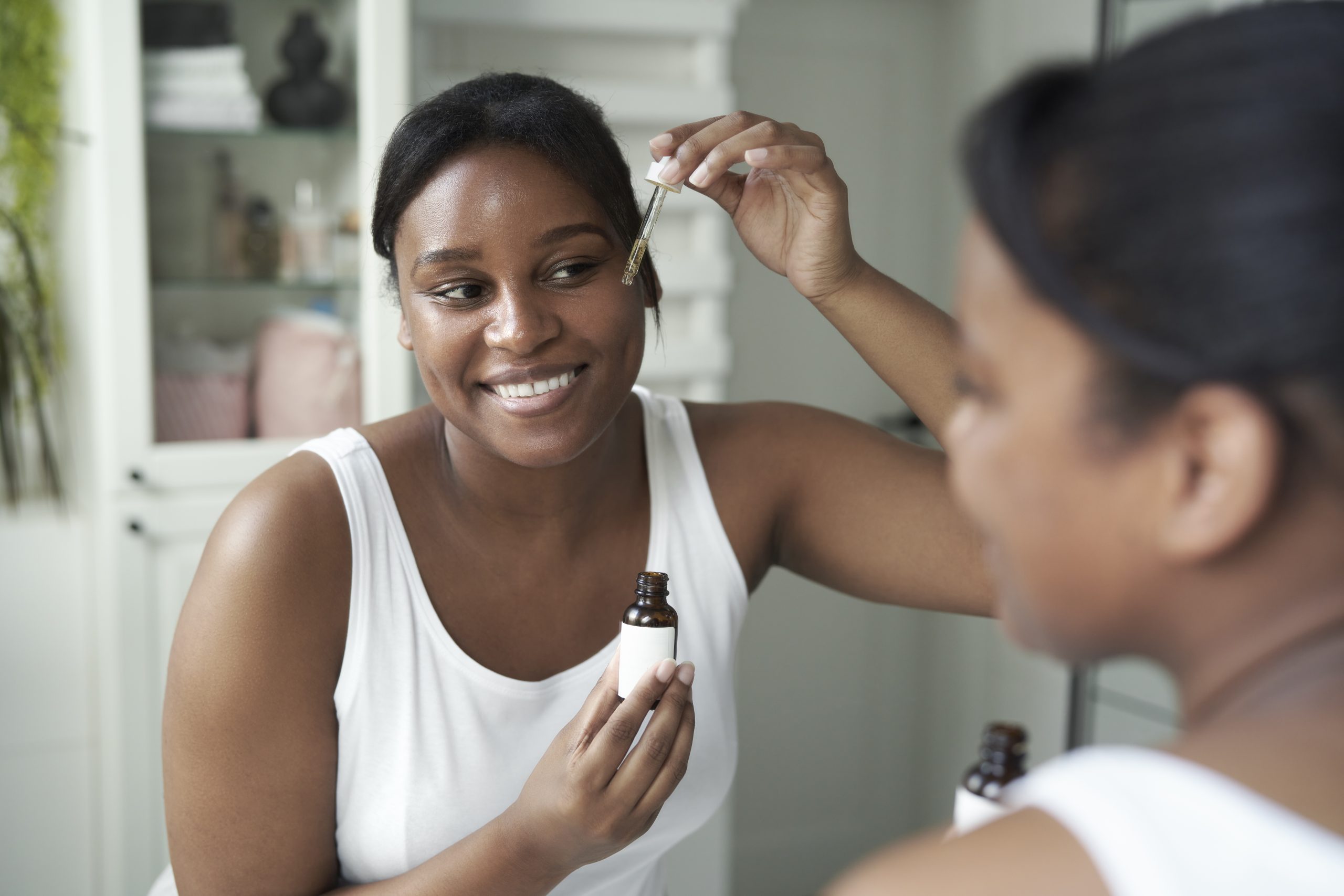 african american woman using serum to face in the 2024 12 04 09 47 16 utc scaled